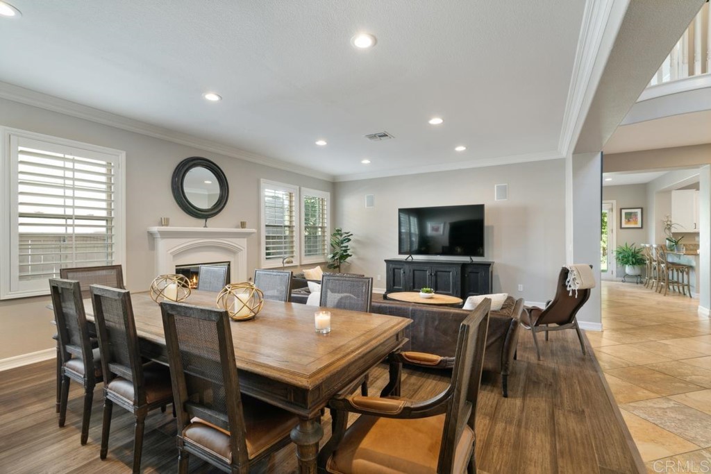 832 Genoa Way San Marcos, CA 92078 - Photo 11 of 42 a view of a dining room with furniture window and wooden floor