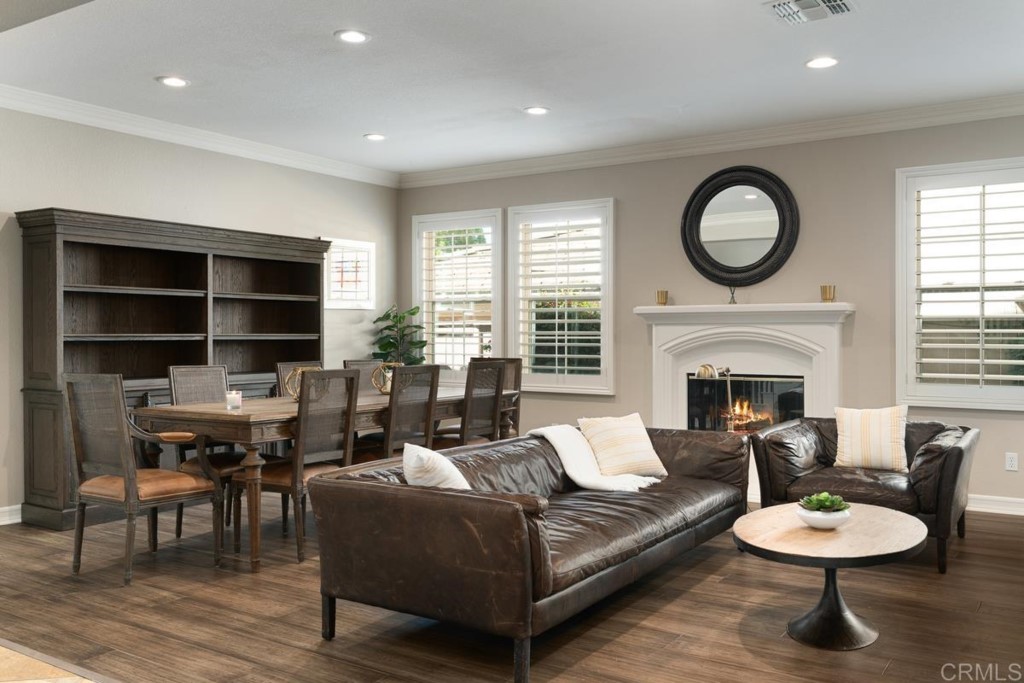 832 Genoa Way San Marcos, CA 92078 - Photo 12 of 42 a living room with furniture a rug and a fireplace