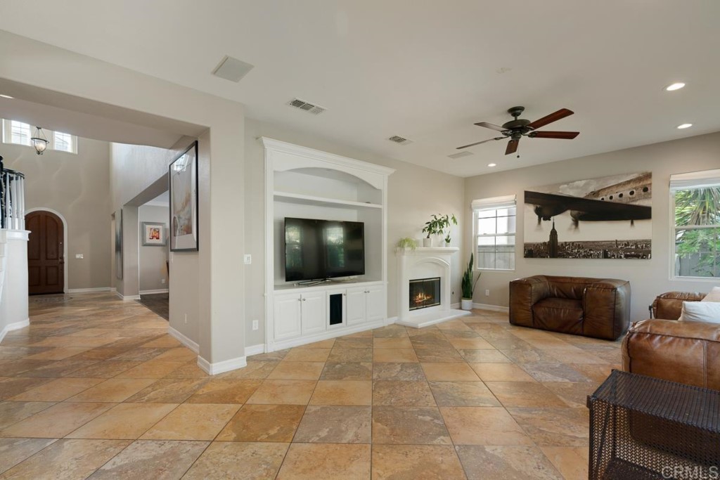 832 Genoa Way San Marcos, CA 92078 - Photo 14 of 42 a living room with furniture and a flat screen tv