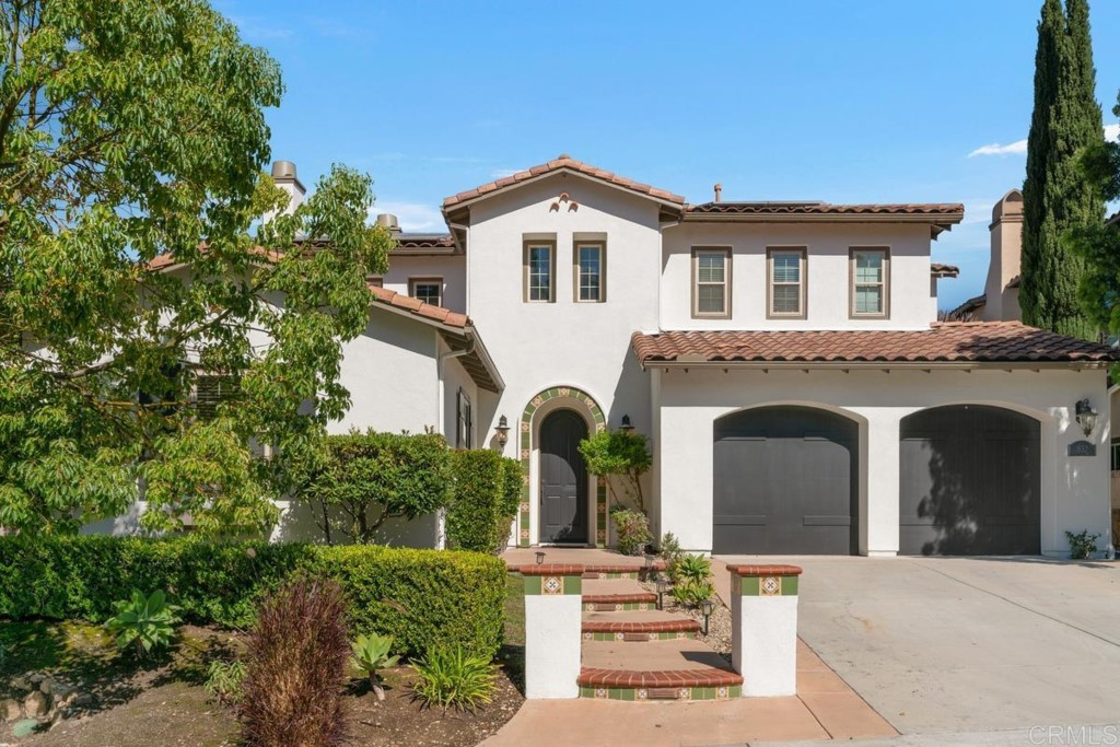 832 Genoa Way San Marcos, CA 92078 - Photo 2 of 42 a front view of a house with garden