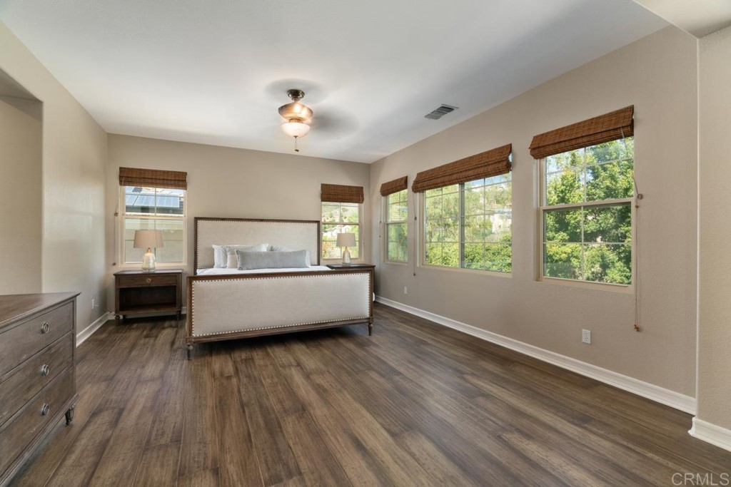 832 Genoa Way San Marcos, CA 92078 - Photo 28 of 42 a living room with a bed furniture and a window