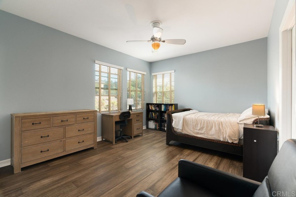 832 Genoa Way San Marcos, CA 92078 - Photo 35 of 42 a bedroom with a bed and window