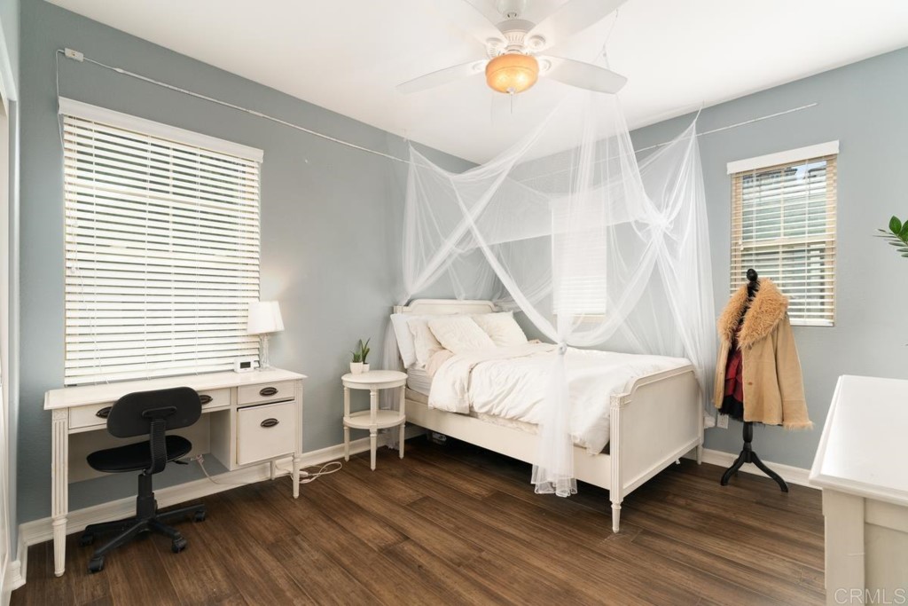 832 Genoa Way San Marcos, CA 92078 - Photo 38 of 42 a bedroom with a bed and a window