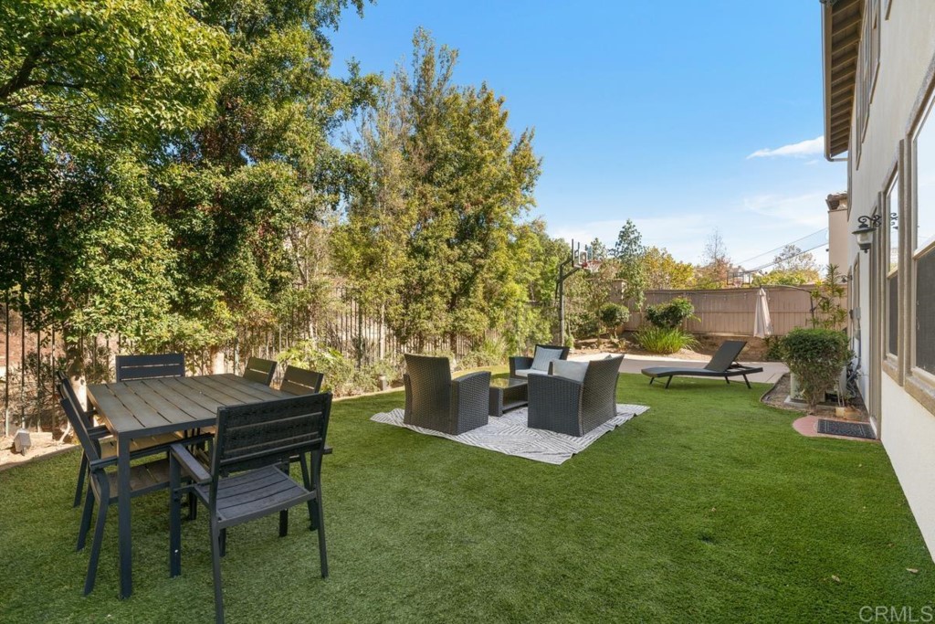 832 Genoa Way San Marcos, CA 92078 - Photo 39 of 42 a view of a table and chairs in the garden