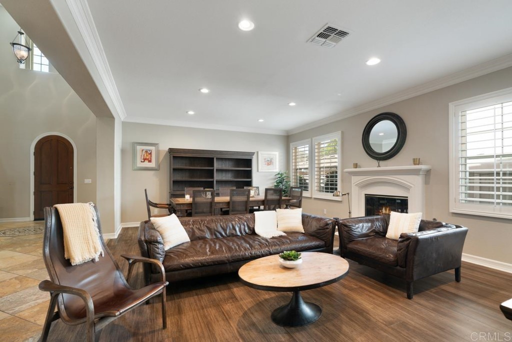 832 Genoa Way San Marcos, CA 92078 - Photo 8 of 42 a living room with furniture a fireplace and a flat screen tv