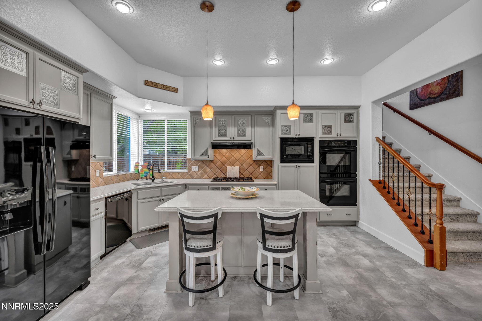 8200 Antler Pointe Court Reno, NV 89523 - Photo 21 of 36 a open kitchen with stainless steel appliances granite countertop a stove and a refrigerator
