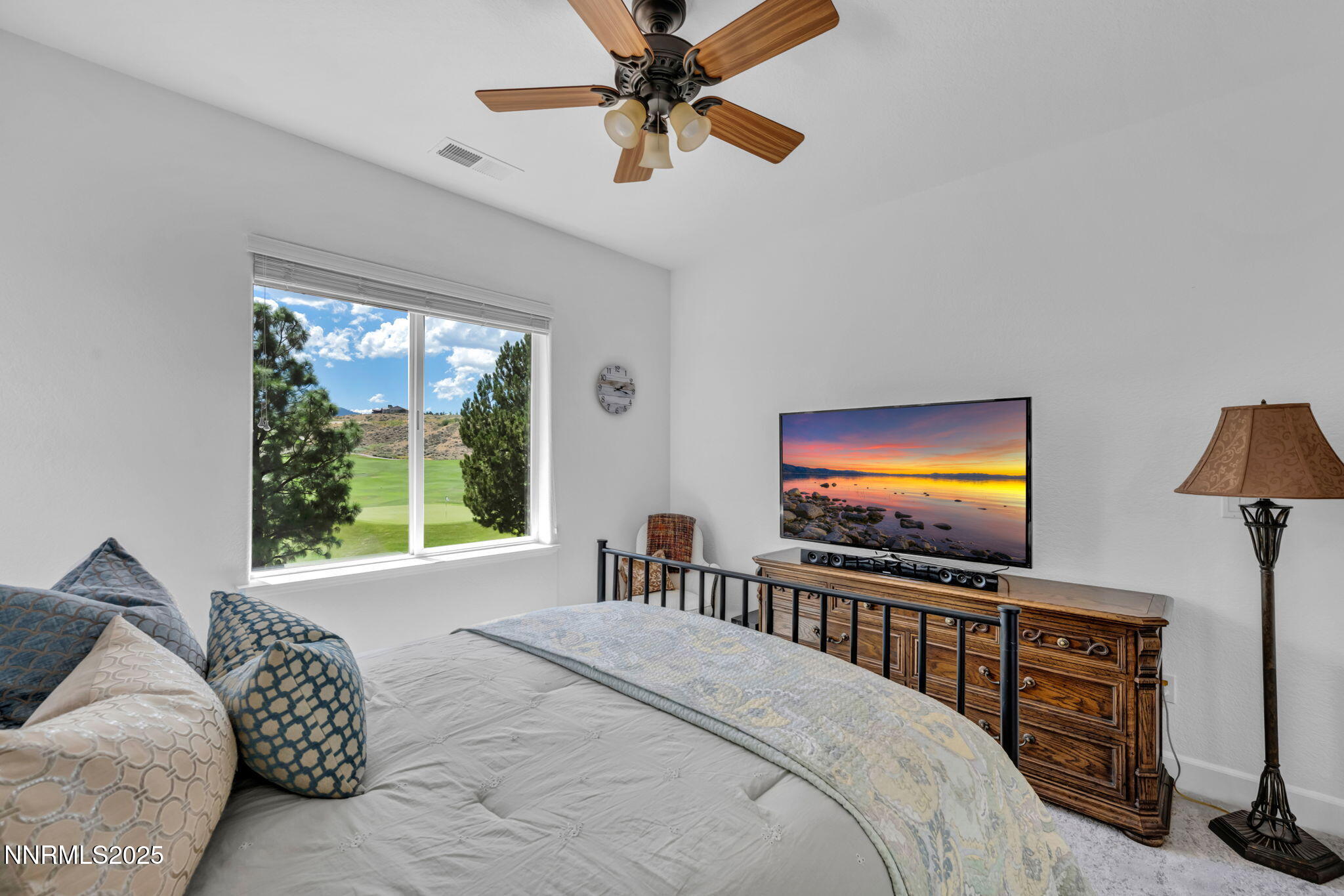 8200 Antler Pointe Court Reno, NV 89523 - Photo 32 of 36 a bedroom with furniture and a flat screen tv