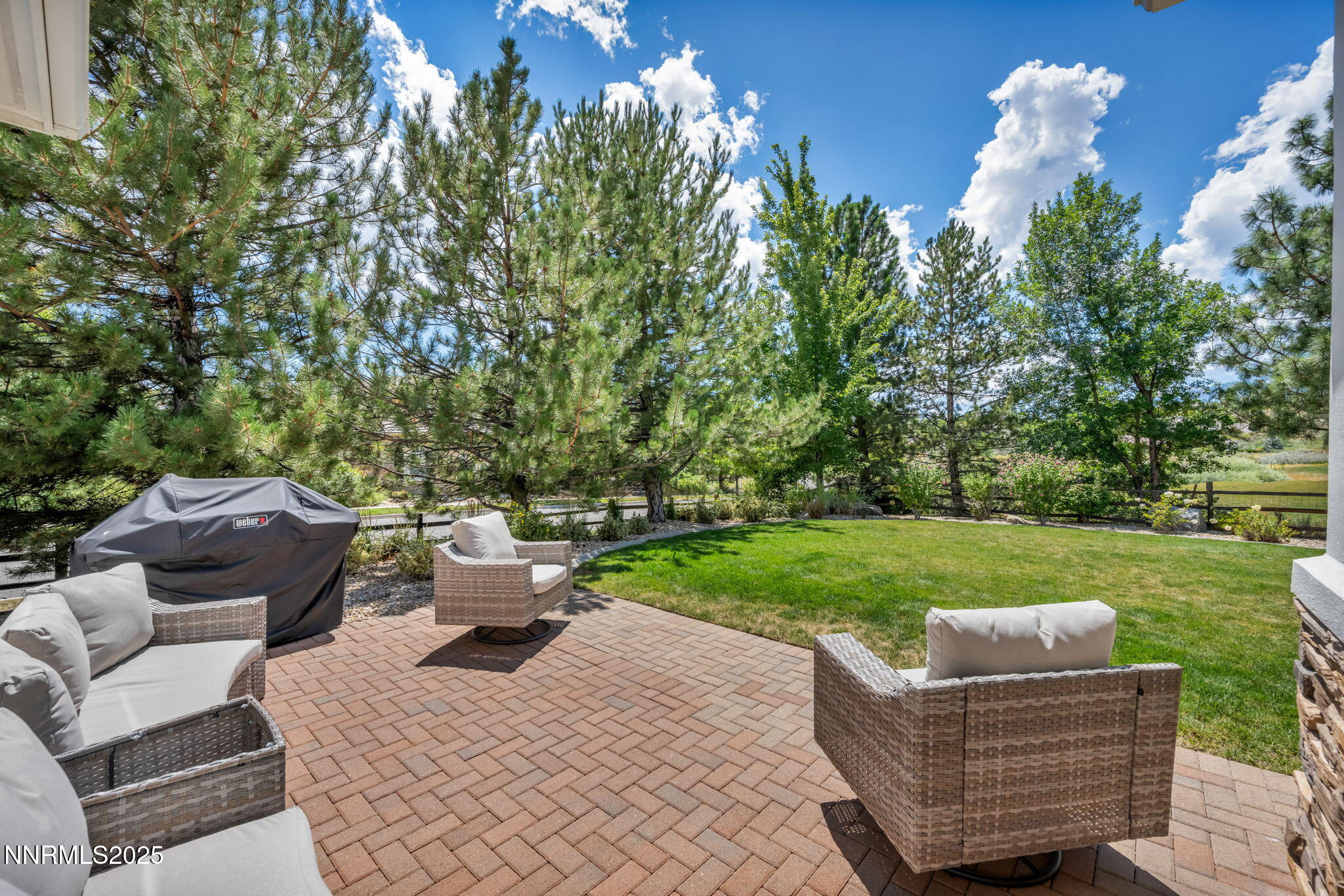 8200 Antler Pointe Court Reno, NV 89523 - Photo 5 of 36 a view of a chair and fire pit in the backyard