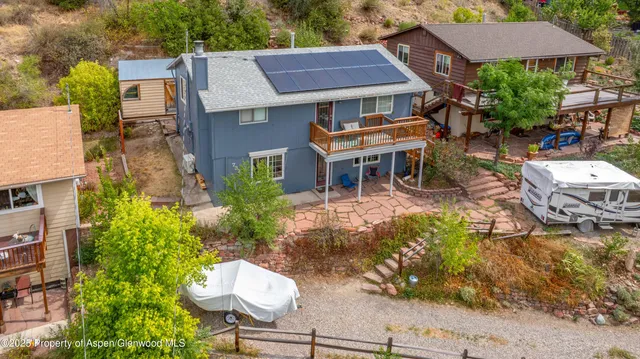 a view of backyard with a patio