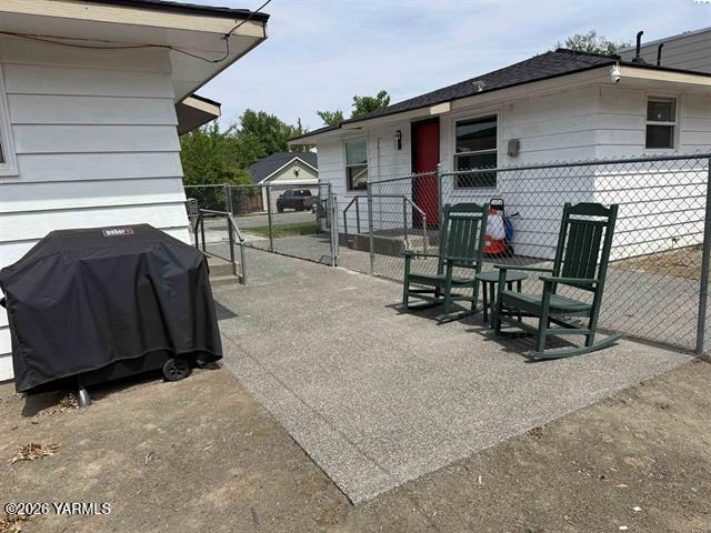 815 Ellen Avenue Prosser, WA 99350 - Photo 3 of 16 a view of backyard with deck and outdoor seating