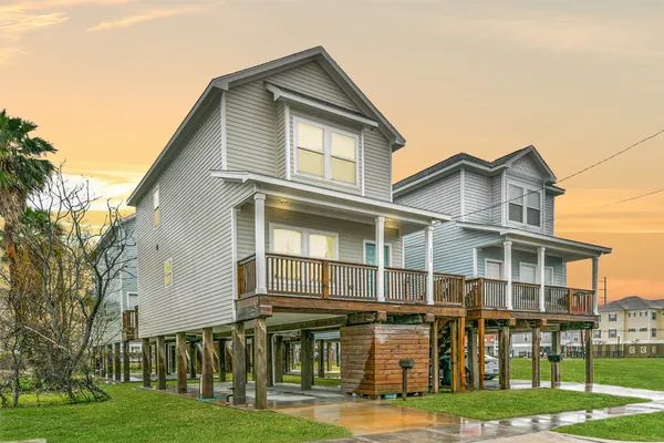 a front view of residential houses with yard