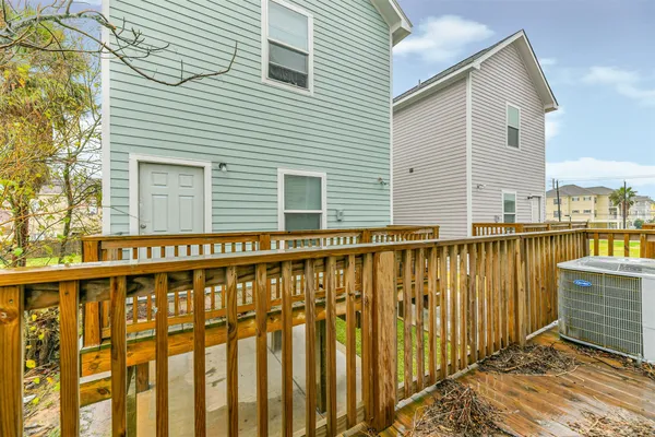 a view of balcony with wooden floor