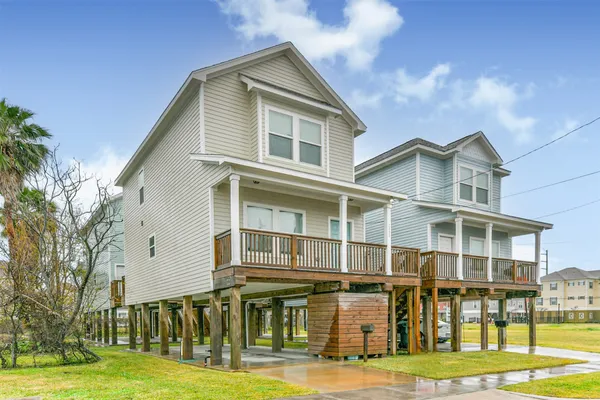 a front view of residential houses with yard