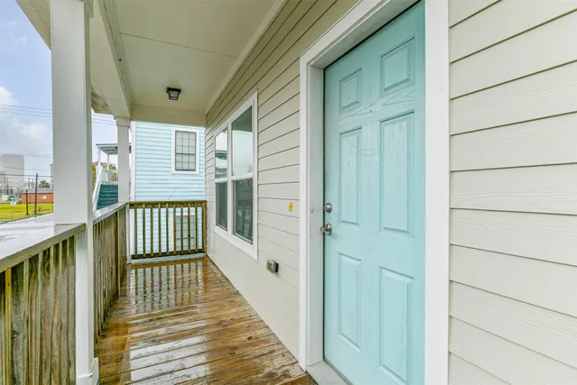 a view of a balcony with wooden floor