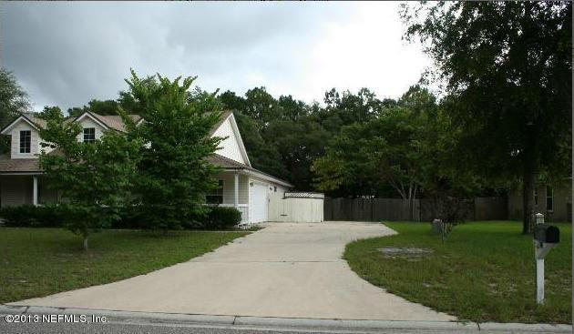 97089 Castle Ridge Drive Yulee, FL 32097 - Photo 4 of 9 a view of a house with a yard