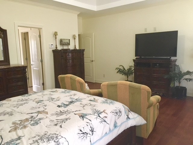 88 Lower Simmons Road Macon, GA 31220 - Photo 14 of 43 a large bedroom with a bed and furniture