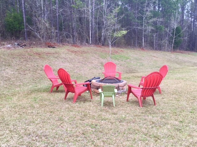 88 Lower Simmons Road Macon, GA 31220 - Photo 23 of 43 a view of a backyard with table and chairs