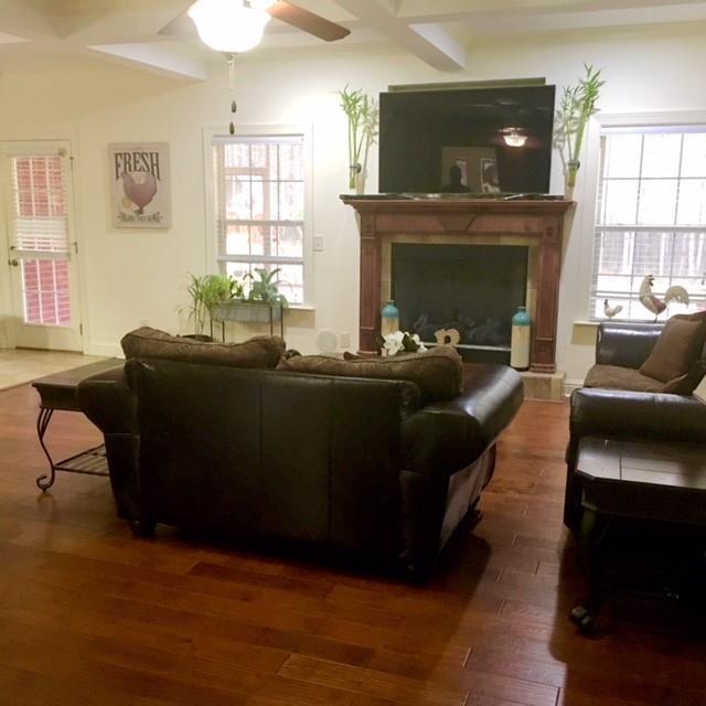 88 Lower Simmons Road Macon, GA 31220 - Photo 27 of 43 a living room with furniture and a fireplace