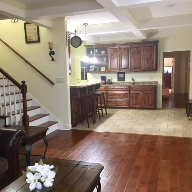 88 Lower Simmons Road Macon, GA 31220 - Photo 29 of 43 a room with lots of wooden furniture and a chandelier