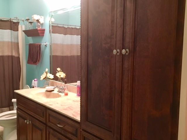 88 Lower Simmons Road Macon, GA 31220 - Photo 33 of 43 a bathroom with a sink vanity and a mirror
