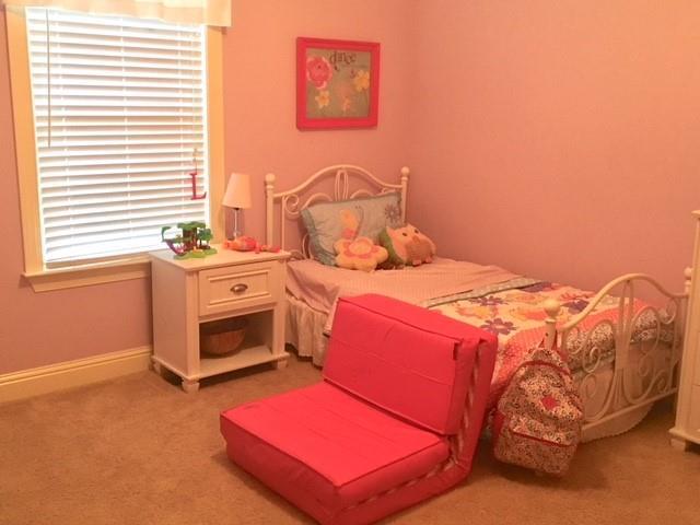 88 Lower Simmons Road Macon, GA 31220 - Photo 38 of 43 a bedroom with a bed and a window