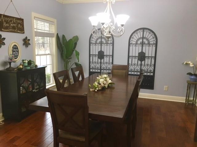 88 Lower Simmons Road Macon, GA 31220 - Photo 39 of 43 a view of a dining room with furniture and chandelier