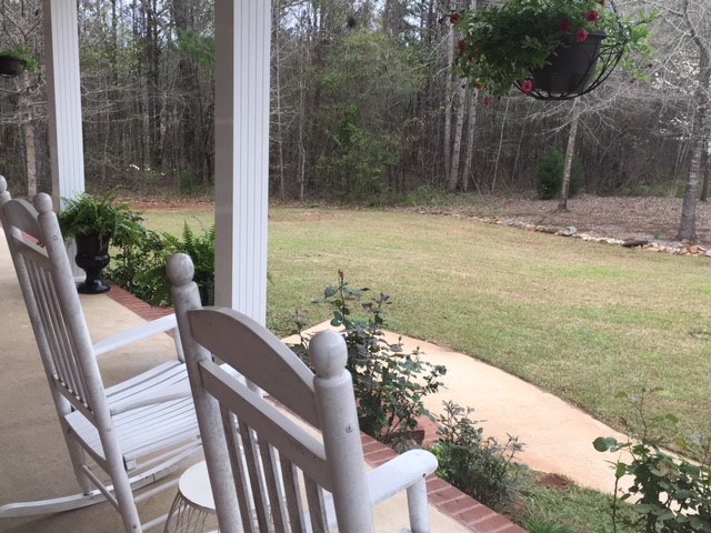88 Lower Simmons Road Macon, GA 31220 - Photo 5 of 43 a view of a balcony with chair and table
