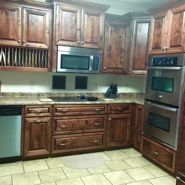 88 Lower Simmons Road Macon, GA 31220 - Photo 10 of 43 a kitchen with granite countertop a stove microwave and cabinets