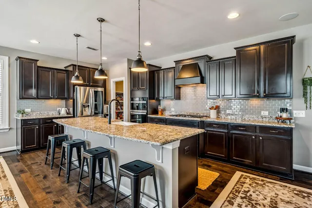 a view of a dining room with furniture and window