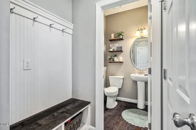 a view of a workspace with furniture and a fireplace