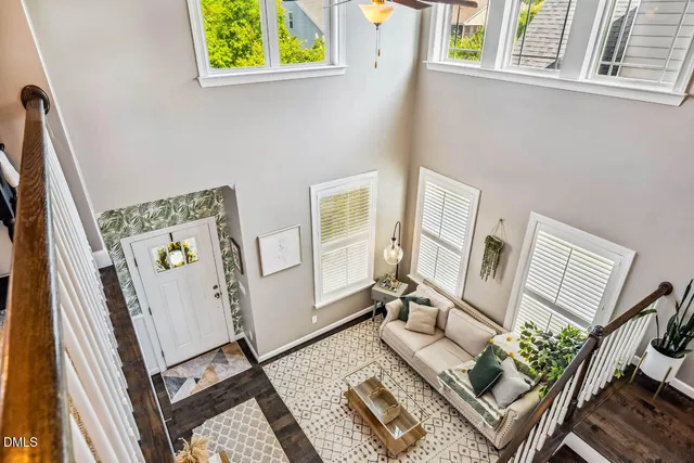 a view of balcony with chairs and iron fence
