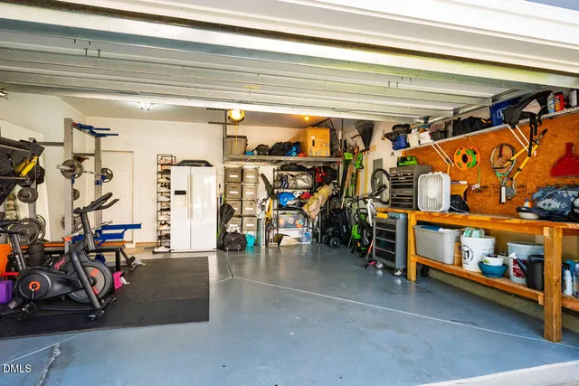 a living room with fireplace furniture and a wooden floor