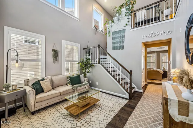 a kitchen with stainless steel appliances granite countertop a stove top oven a sink a stove a dining table and chairs