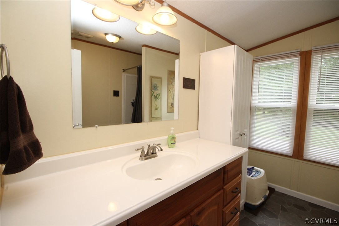 4278 Dorrell Road Aylett, VA 23009 - Photo 13 of 34 a bathroom with a sink vanity granite tub and a mirror
