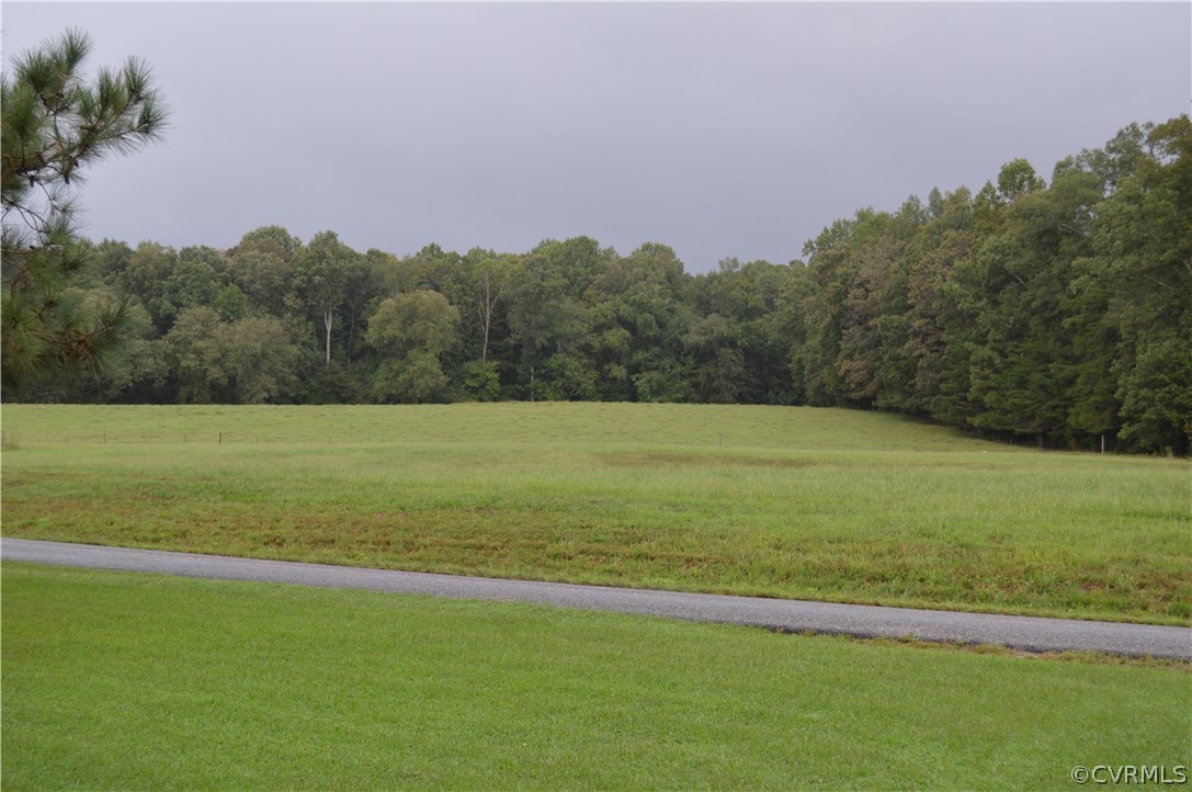4278 Dorrell Road Aylett, VA 23009 - Photo 29 of 34 a view of a field with an ocean and trees
