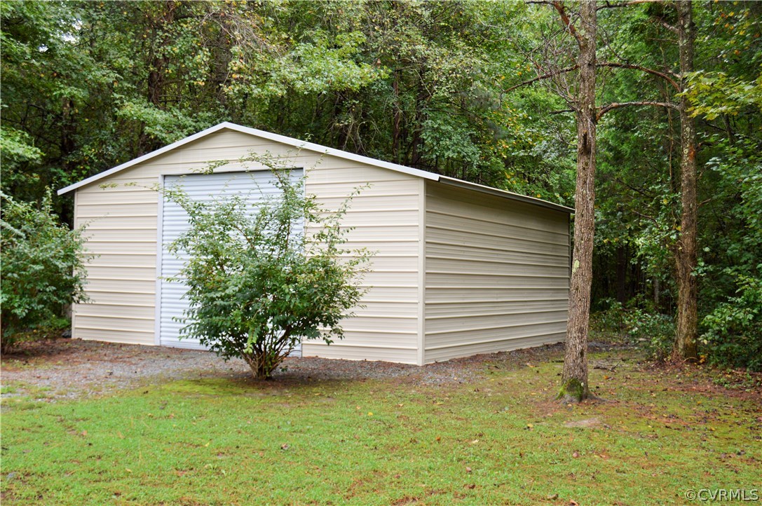 4278 Dorrell Road Aylett, VA 23009 - Photo 32 of 34 a front view of a house with a garden