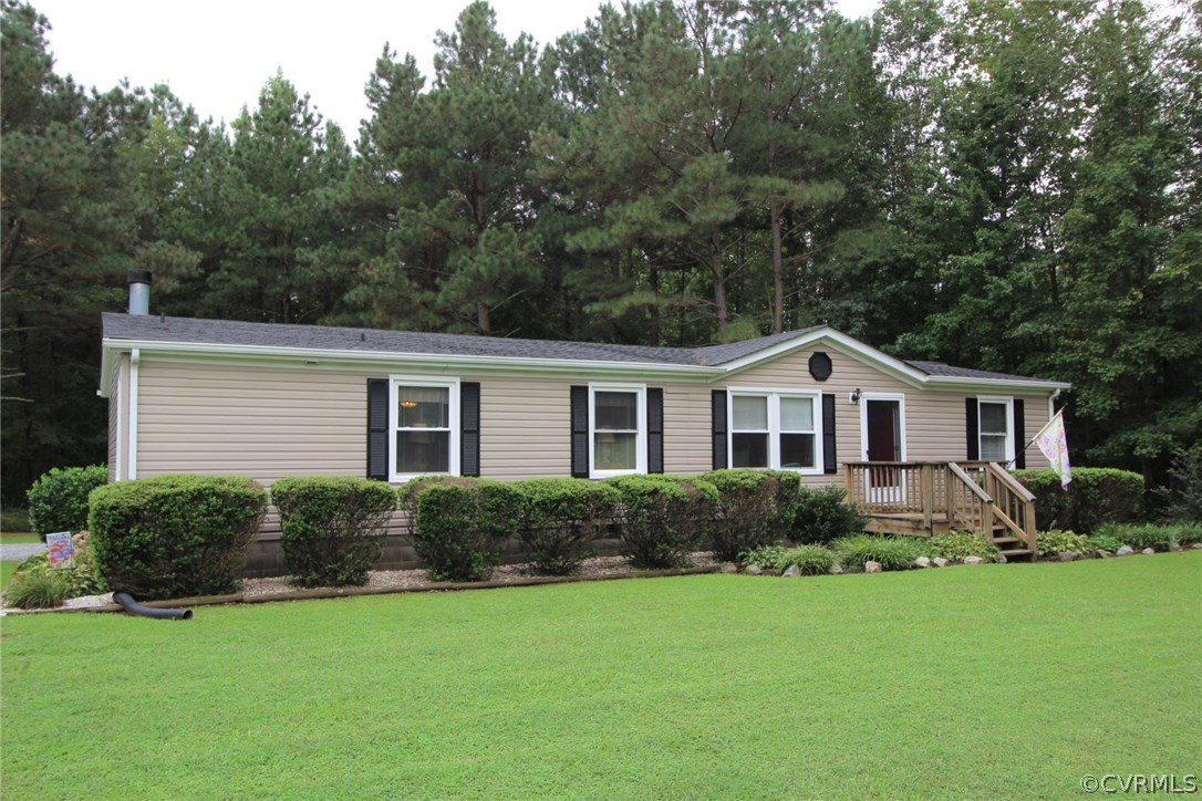 4278 Dorrell Road Aylett, VA 23009 - Photo 34 of 34 a front view of a house with a yard and trees