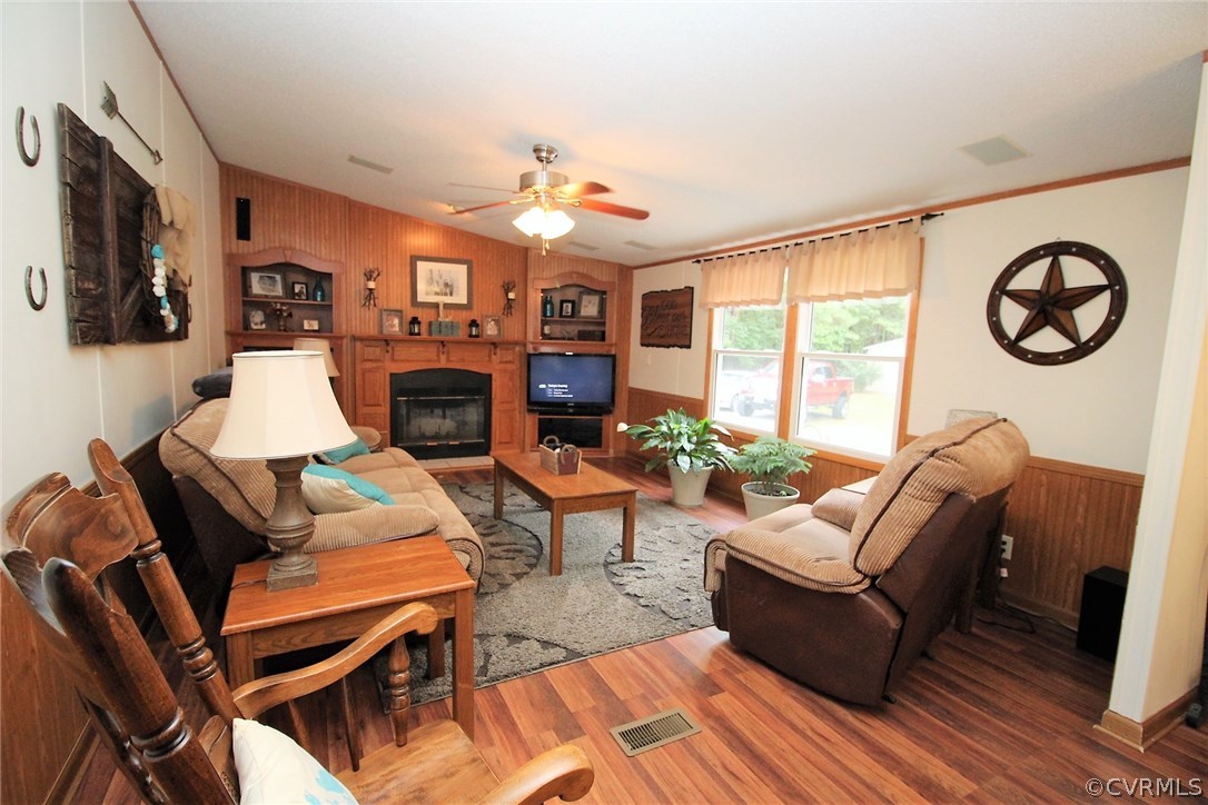 4278 Dorrell Road Aylett, VA 23009 - Photo 4 of 34 a living room with fireplace furniture and a flat screen tv