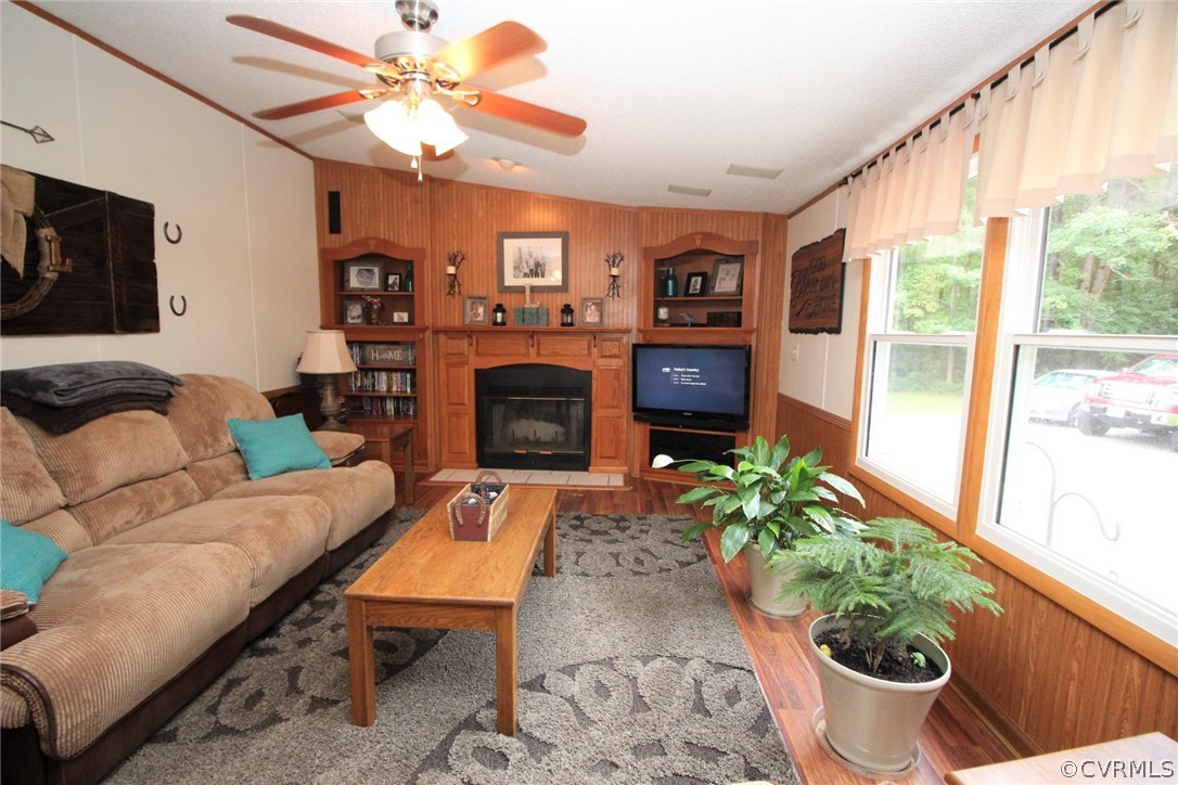 4278 Dorrell Road Aylett, VA 23009 - Photo 5 of 34 a living room with furniture a flat screen tv and a fireplace