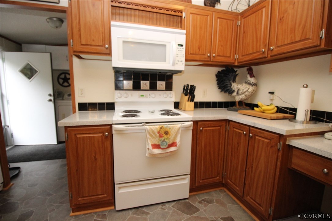 4278 Dorrell Road Aylett, VA 23009 - Photo 9 of 34 a kitchen with stainless steel appliances granite countertop a sink stove and cabinets