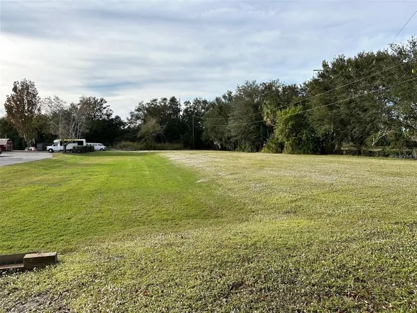 a view of a lake with a big yard
