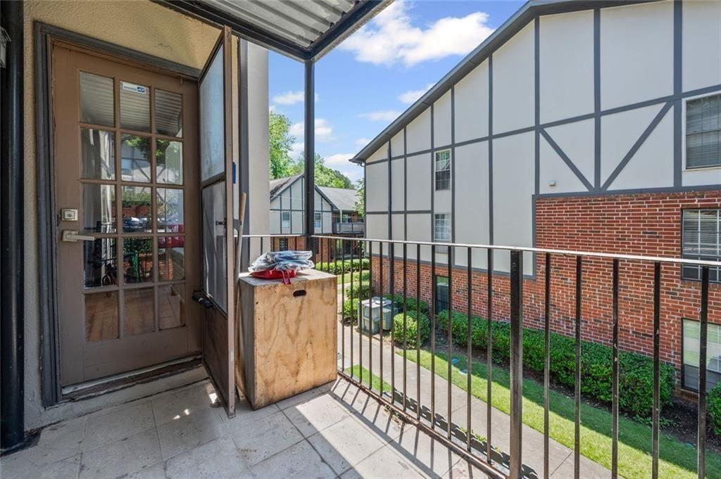 6851 Roswell Road, Unit E4 Atlanta, GA 30328 - Photo 18 of 26 a view of a house with a porch