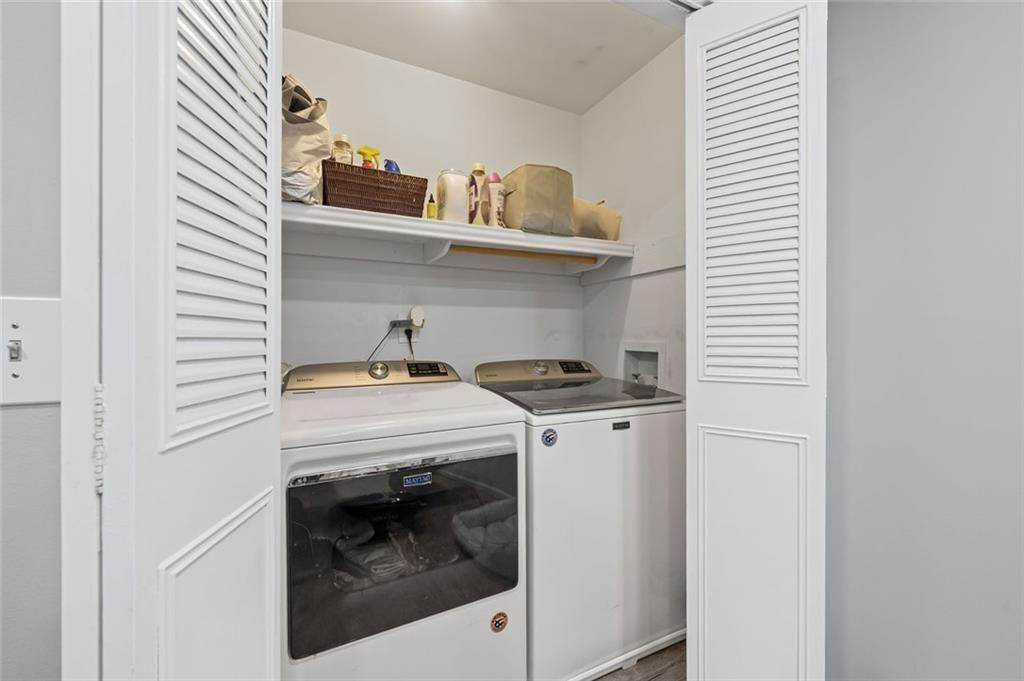 6851 Roswell Road, Unit E4 Atlanta, GA 30328 - Photo 9 of 26 a close up view of washer and dryer