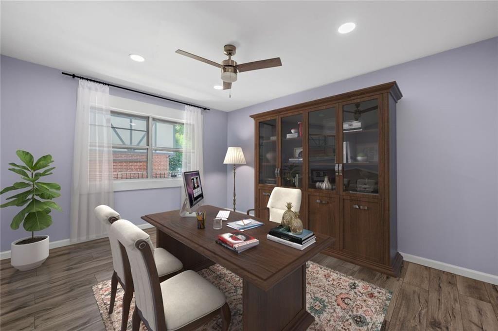 6851 Roswell Road, Unit E4 Atlanta, GA 30328 - Photo 10 of 26 a dining room with furniture a chandelier and wooden floor