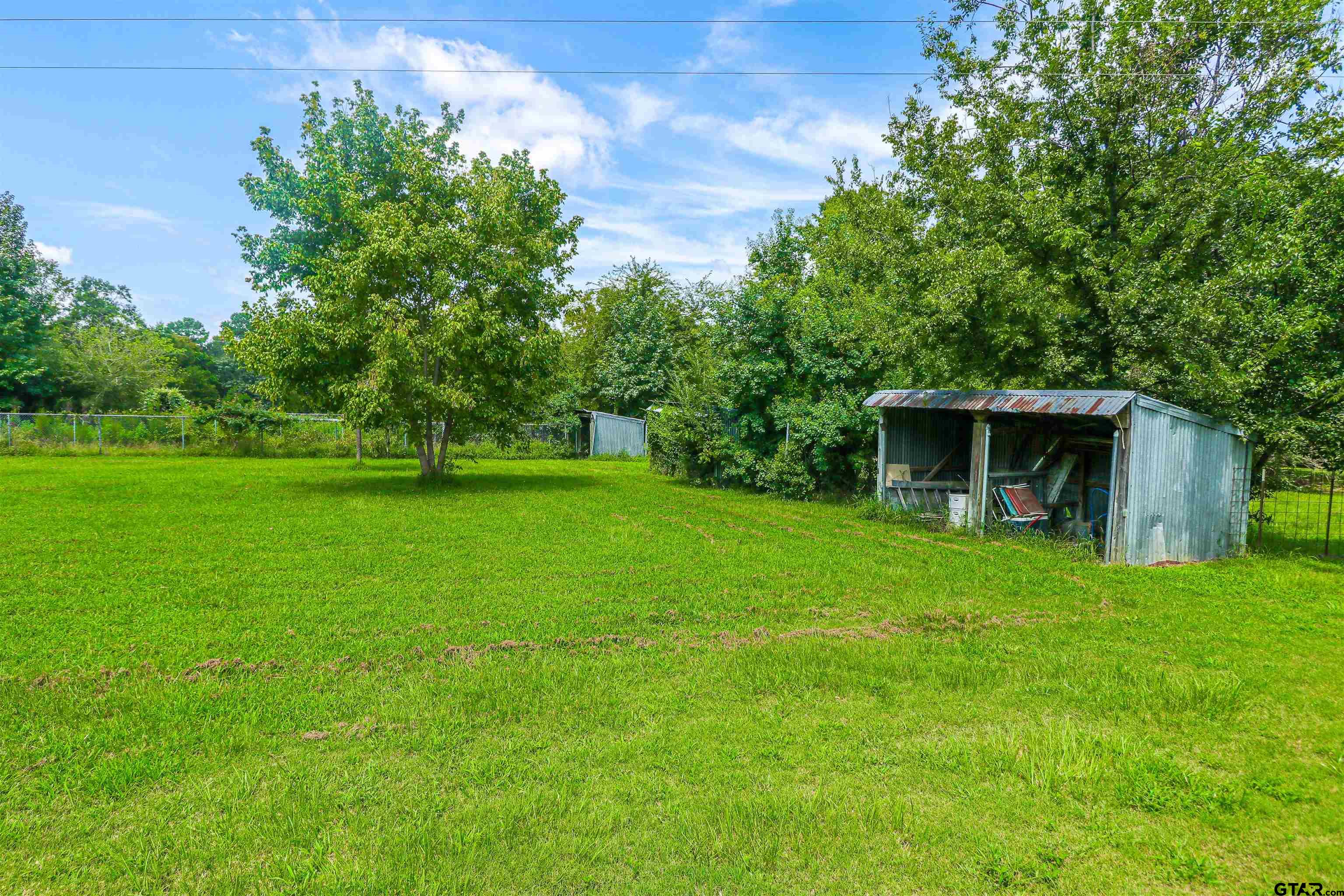 830 County Road 2201 Rusk, TX 75785 - Photo 11 of 40 a front view of a house with garden