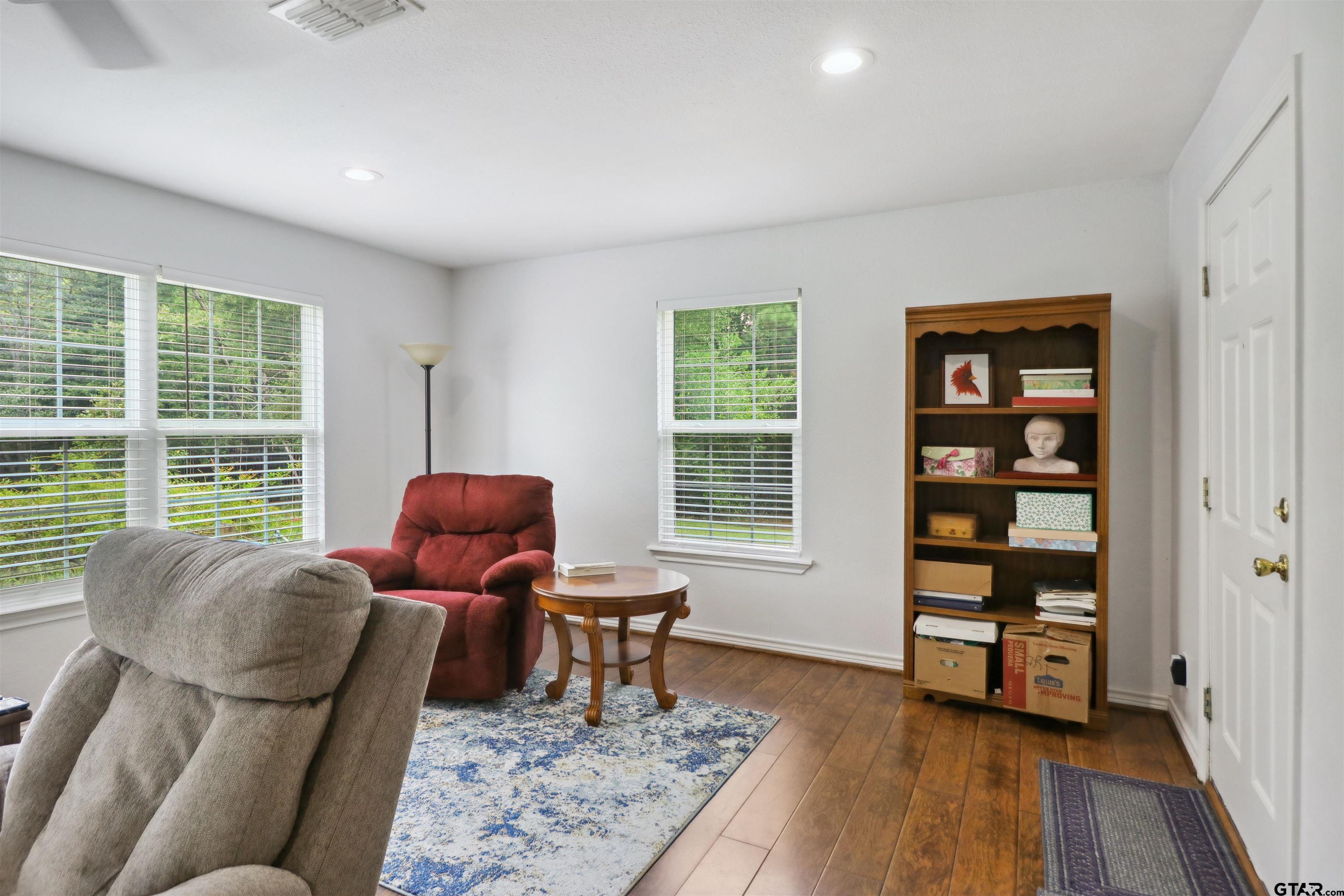 830 County Road 2201 Rusk, TX 75785 - Photo 12 of 40 a living room with furniture and a floor to ceiling window