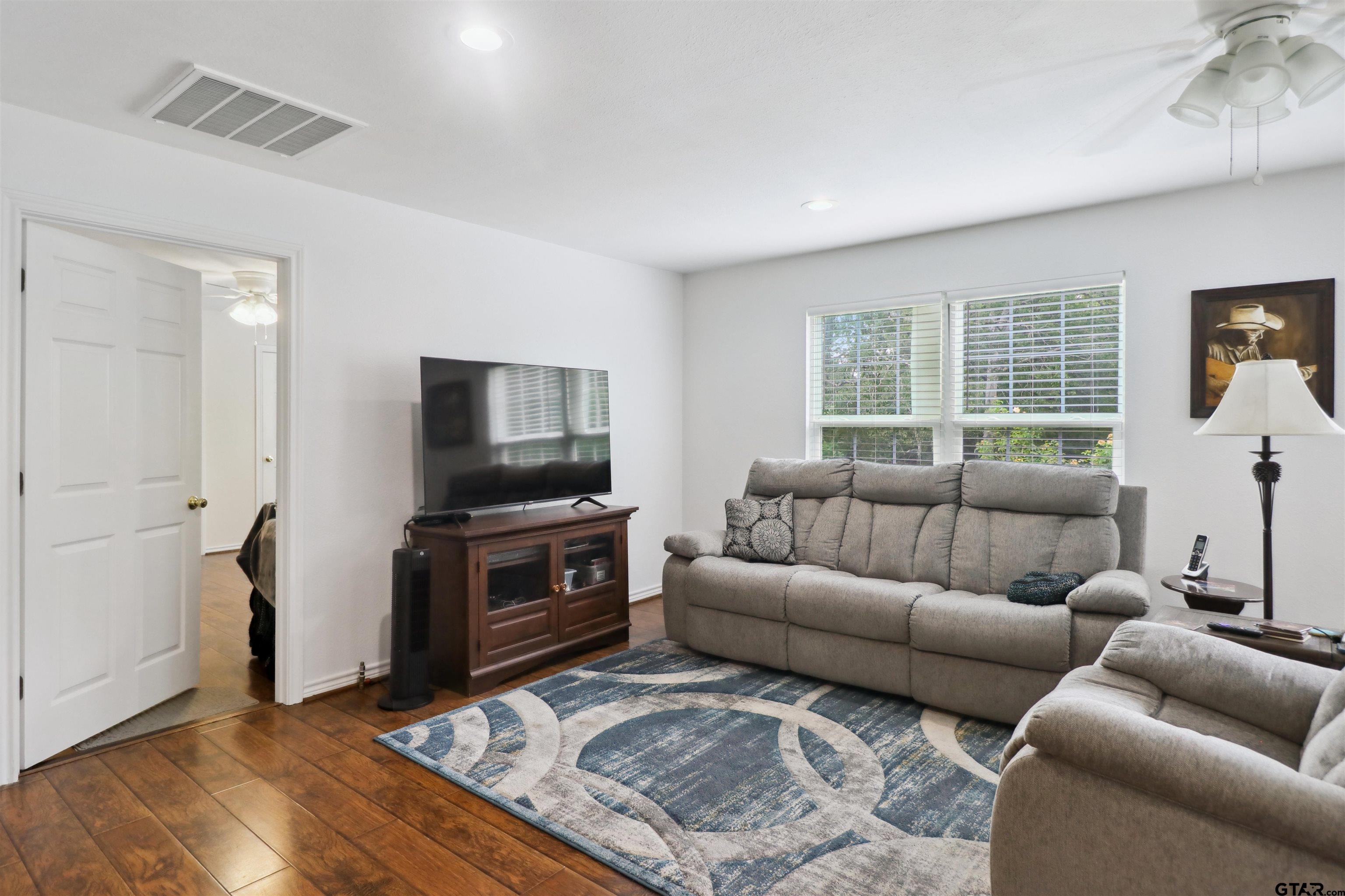 830 County Road 2201 Rusk, TX 75785 - Photo 13 of 40 a living room with furniture and a flat screen tv
