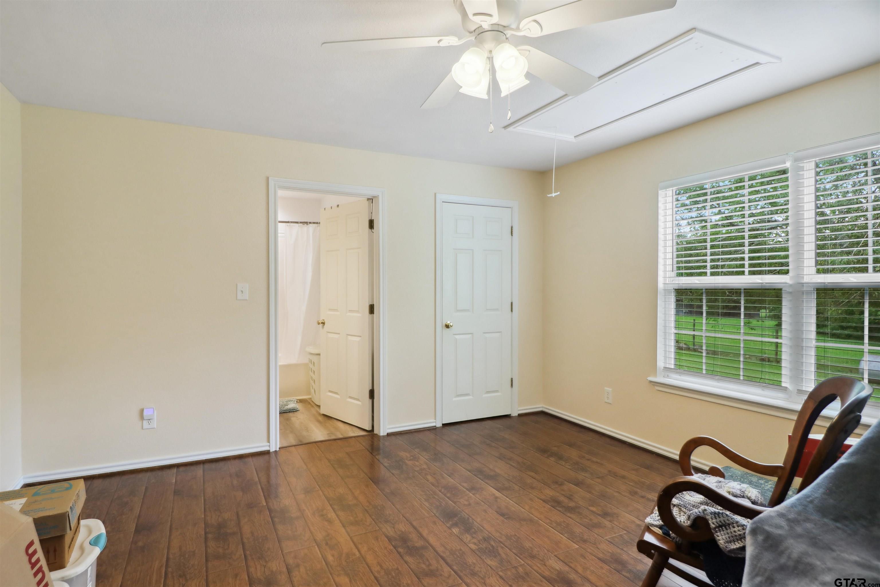 830 County Road 2201 Rusk, TX 75785 - Photo 23 of 40 a view of a room with wooden floor and windows