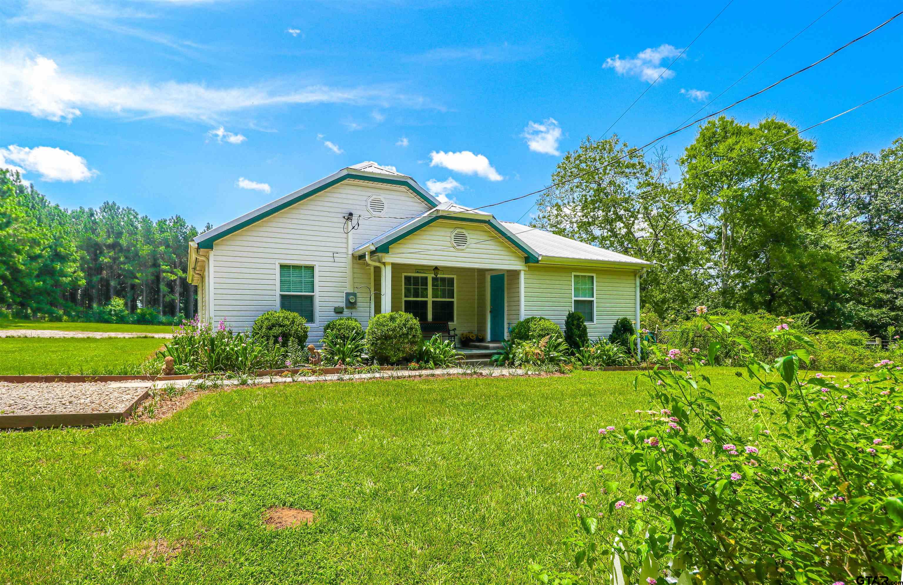 830 County Road 2201 Rusk, TX 75785 - Photo 39 of 40 a front view of a house with a yard