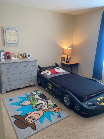 a bedroom with a bed and toys
